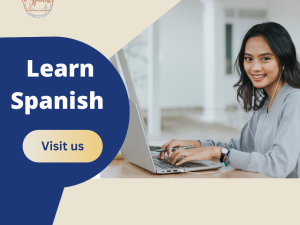 Woman learning Spanish on laptop, smiling.
