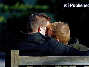 Couple embracing on a park bench.